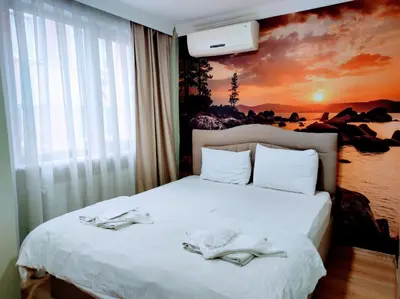a bedroom with a bed with two towels on it at Seyri Istanbul Hotel in Istanbul