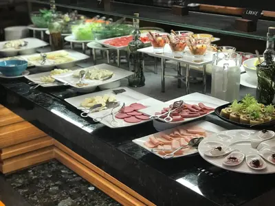 a buffet with many plates of food on a table at Holiday Inn Bursa - City Centre by IHG in Bursa