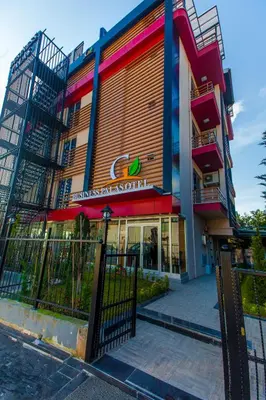 a building with a fence in front of it at Business Palas Otel in Kocaeli