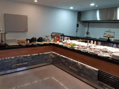 a buffet line with many different types of food at Business Palas Otel in Kocaeli