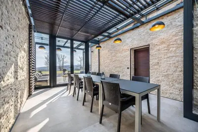a dining room with a table and chairs at Palivor Çiftliği in Korfo