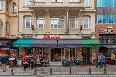 a group of people walking in front of a building at Alpek Hotel in Istanbul