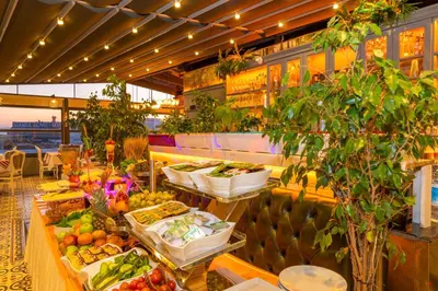 a buffet line with fruits and vegetables on display at Alpek Hotel in Istanbul