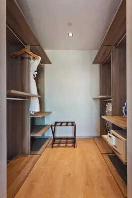 a room with wooden shelves and a bench in it at Fraser Place Antasya Istanbul in Istanbul