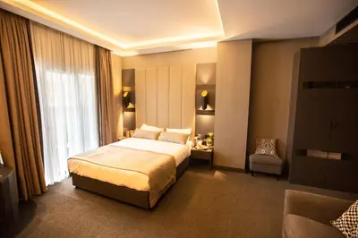a hotel room with a bed and a chair at Cityloft 24 in Istanbul