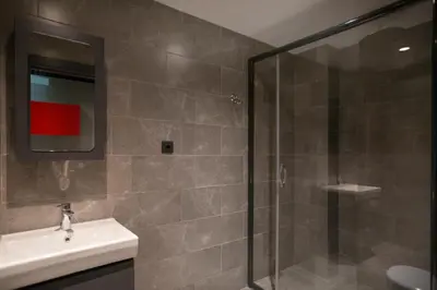 a bathroom with a sink and a glass shower at Cityloft 24 in Istanbul