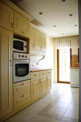 a kitchen with a stove and a microwave at Villa Bursa in Bursa