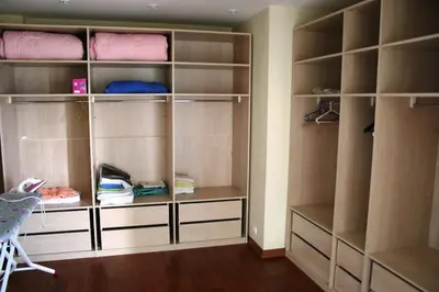 a walk in closet with empty shelves at Villa Bursa in Bursa