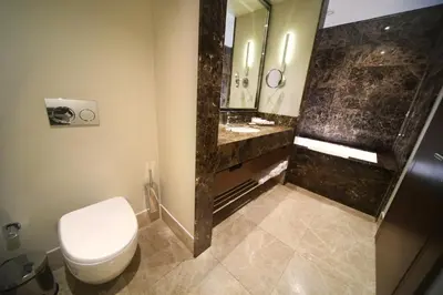 a bathroom with a toilet and a shower at Mercure Istanbul West Hotel & Convention Center in Istanbul