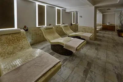 a waiting room with a row of chairs and mirrors at Richmond Nua Wellness Spa - Adult Only in Sapanca