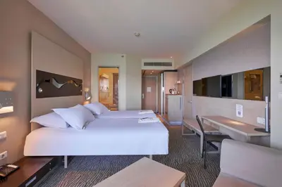 a hotel room with a large bed and a desk at Richmond Nua Wellness Spa - Adult Only in Sapanca
