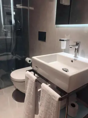 a bathroom with a white sink and a toilet at Lady Diana Hotel in Istanbul