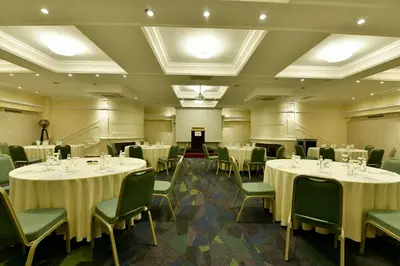 a banquet room with tables and chairs and a podium at Crowne Plaza Istanbul - Old City by IHG in Istanbul
