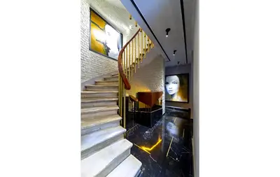 a spiral staircase in a building with a stair case at Walton Hotels Galata in Istanbul
