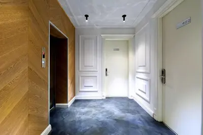 an empty hallway with white walls and a door at Walton Hotels Galata in Istanbul