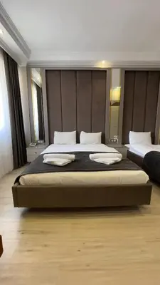 a large bedroom with two beds in a room at Reyyan Hotel in Istanbul