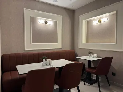 a restaurant dining room with two tables and chairs at Pasa Hotel Gemlik in Gemlik