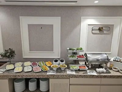 a kitchen with a buffet of food on a counter at Pasa Hotel Gemlik in Gemlik
