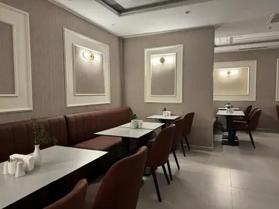 a restaurant dining room with tables and chairs at Pasa Hotel Gemlik in Gemlik