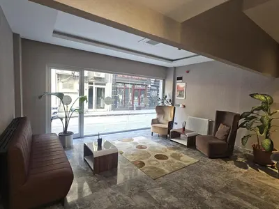 a living room with a couch and chairs and a table at Pasa Hotel Gemlik in Gemlik