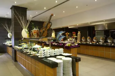 a buffet in a restaurant with plates on a table at ADM Grand Hotel in Istanbul