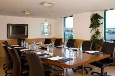 a large conference room with a long table and chairs at ADM Grand Hotel in Istanbul