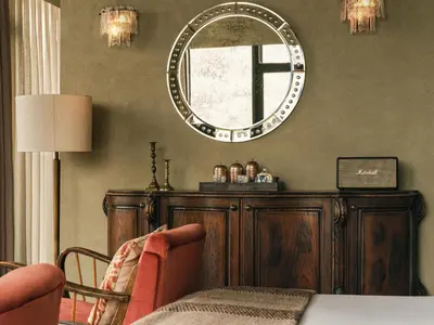 a living room with a mirror on the wall at Soho House Istanbul in Istanbul