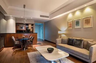a living room with a couch and a table at Istanbul Marriott Hotel Asia in Istanbul