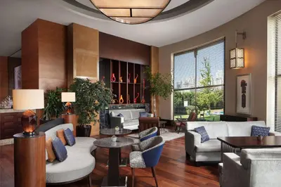 a living room with furniture and a large window at Istanbul Marriott Hotel Asia in Istanbul