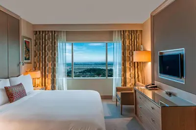 a hotel room with a large bed and a large window at Renaissance Polat Istanbul Hotel in Istanbul