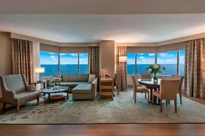 a living room with a couch and a table at Renaissance Polat Istanbul Hotel in Istanbul