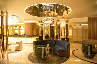 a lobby with a couch and a chandelier at The Hotel Beyaz Saray Old City in Istanbul