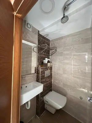 a bathroom with a toilet and a sink at Okur Otel in Istanbul