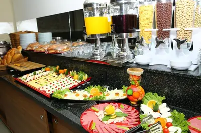 a buffet with many different types of food on a counter at Golden Lounge Hotel in Istanbul