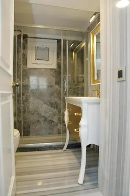a bathroom with a sink and a shower at Art Nouveau Pera in Istanbul