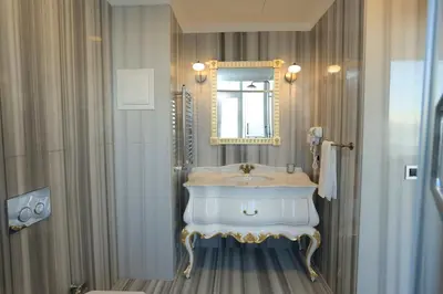 a bathroom with a sink and a mirror at Art Nouveau Pera in Istanbul
