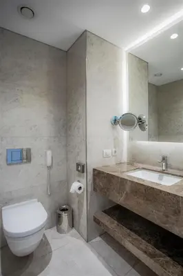 a bathroom with a toilet and a sink and a mirror at Wish More Hotel Istanbul in Istanbul