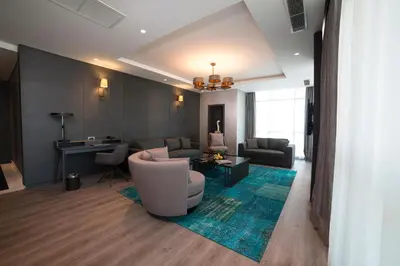 a living room with a couch and a table at Wish More Hotel Istanbul in Istanbul