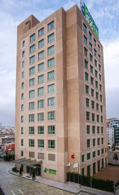 a tall building with a sign on top of it at Park Dedeman Bostanci Hotel in Istanbul