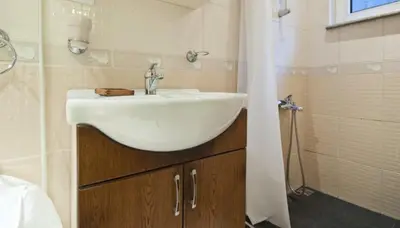a bathroom with a sink and a shower at Inin Bebek in Istanbul