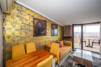 a living room with a couch and a table at Marida Suit - Istanbul Taksim in Istanbul