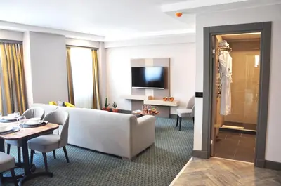 a living room with a couch and a table at Tophane Suites in Istanbul