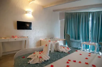 a bedroom with a bed with hearts on it at Agva Nehir Evi - Adult Only in Agva