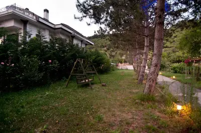 a yard with a ladder in front of a house at Agva Nehir Evi - Adult Only in Agva