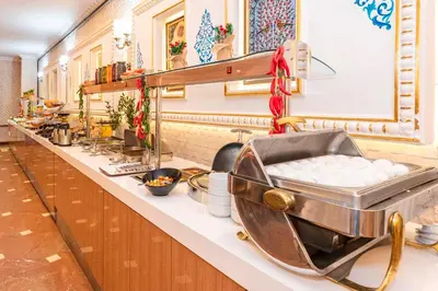 a kitchen with a counter with a bowl of food at The Byzantium Suites Hotel & Spa in Istanbul