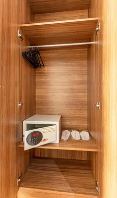 a microwave on a shelf in a cabinet at Elasophia Hotel in Istanbul