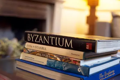 a stack of books sitting on a table at Hotel Ibrahim Pasha in Istanbul