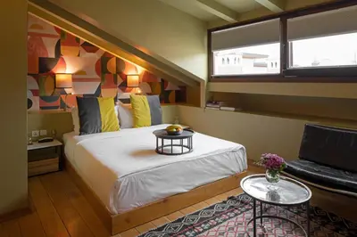 a bedroom with a large bed and a window at Hotel Ibrahim Pasha in Istanbul
