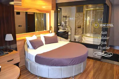 a bedroom with a large bed with a bath tub at Gumus Palace Suites in Istanbul