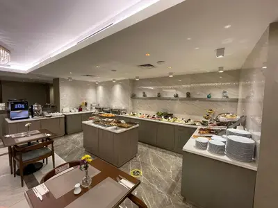 a restaurant with a buffet line with food on display at Asur Hotel in Istanbul